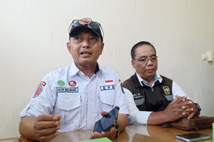 Kepala Pelaksana BPBD Kota Yogyakarta, Nur Hidayat (kiri), dan Ketua Forum Kampung Tangguh Bencana Kota Yogyakarta, Tri Handoko (kanan).