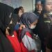 Tersangka kekerasan kepada balita di Daycare Little Aresha saat dibawa ke mobil tahanan.