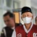 Mantan Jagabaya Kalurahan Condongcatur dibawa oleh anggota Kejaksaan Tinggi (Kejati) DIY usai ditetapkan menjadi tersangka penyalahgunaan Tanah Kas Desa di Padukuhan Pringwulung bersama mantan Lurah Condoncatur berinisial R, Selasa (30/6/2026).
