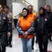 Bupati Sukoharjo, Etik Suryani, mengenakan rompi tahanan usai menjalani pemeriksaan di Gedung Merah Putih KPK, Jakarta, Sabtu (11/7/2026).